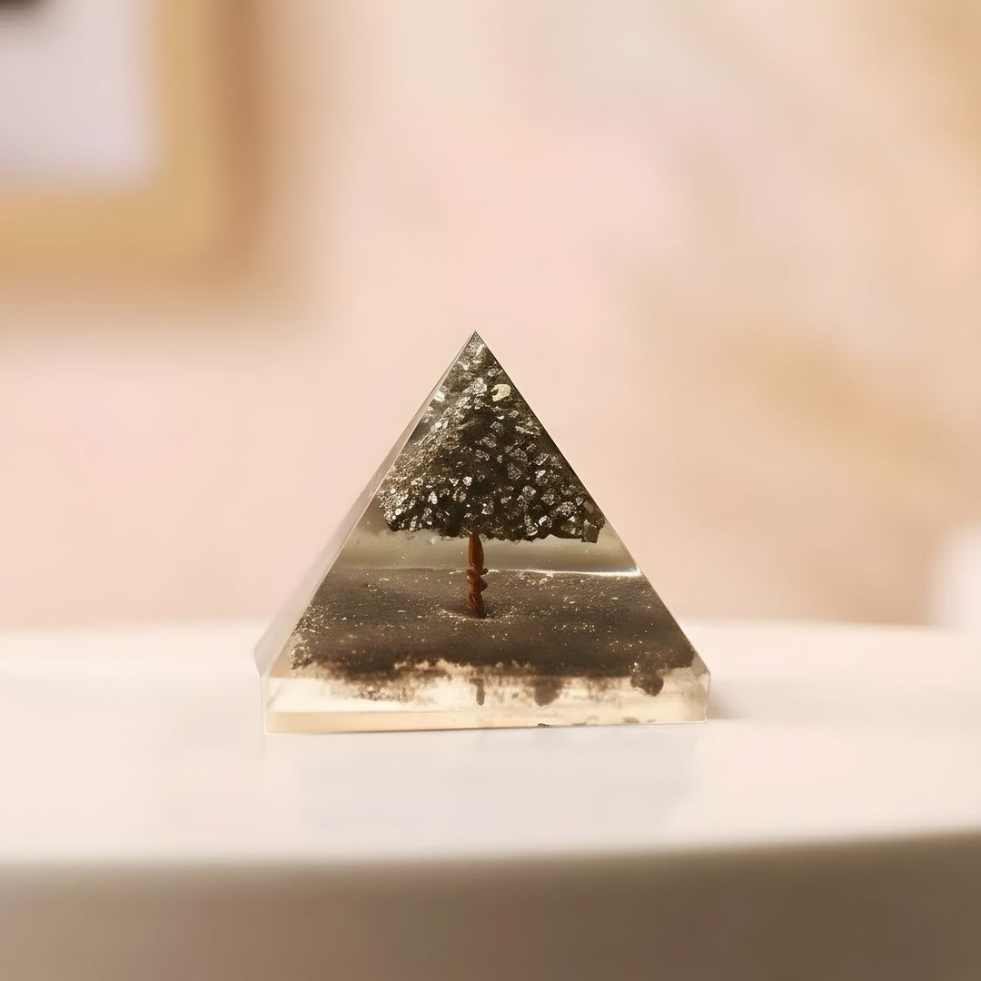 Triangular crystal with tree inside on a light background